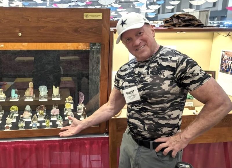 Tom showing off his mineral display at the 2024 Tucson Mineral and Gem Show